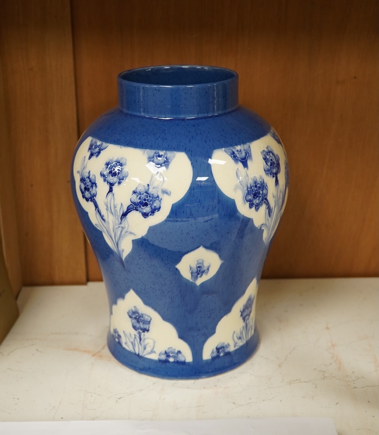 A large Moorcroft late Florian forget-me-nots powder blue temple jar, 29cm high. Condition - fair, chip to base